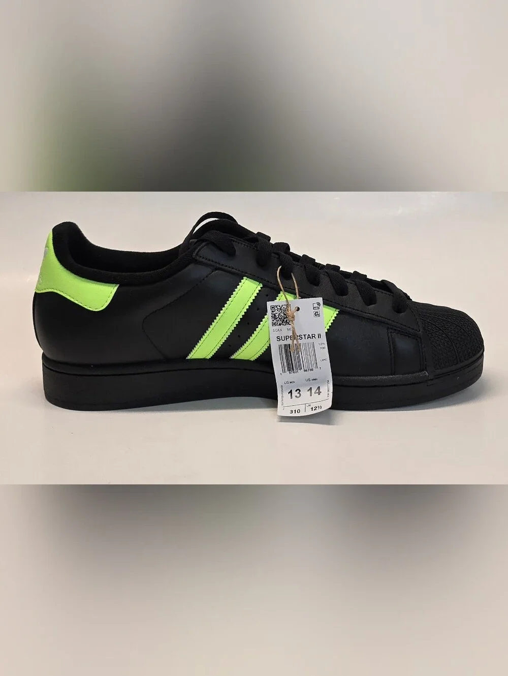adidas Men’s Black Sneakers with Neon Green Stripes